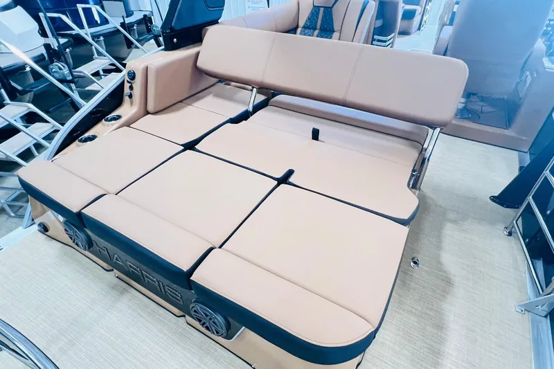 Slide: The Image of 2025 Harris 250 Grand Mariner V10 400 boat interior with luxurious tan seating. - 26