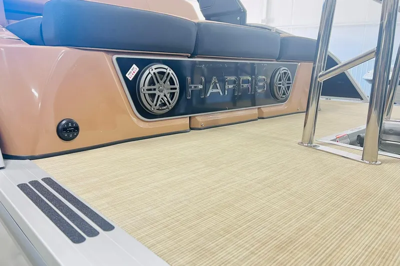 Slide: The Image of 2025 Harris 250 Grand Mariner boat interior with logo and speaker detail. - 41