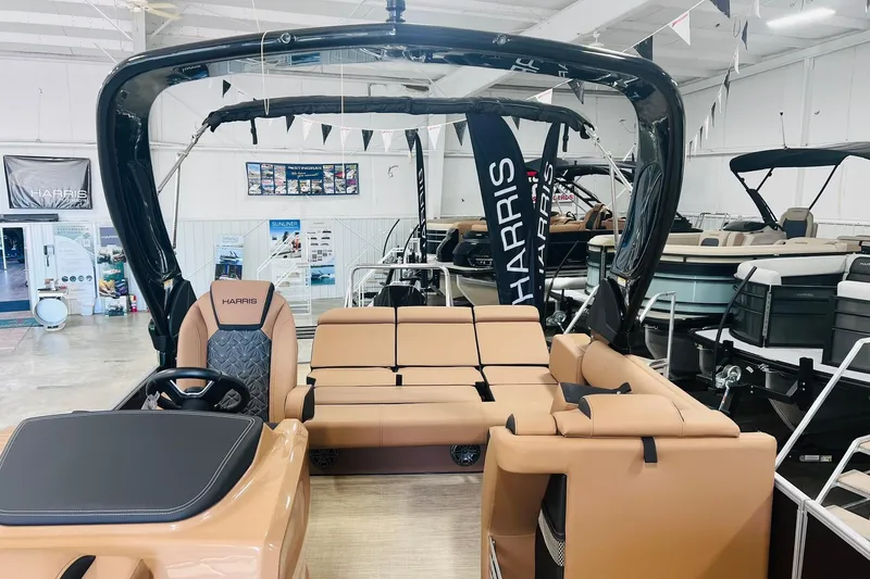 Slide: The Image of 2025 Harris 250 Grand Mariner V10 400 luxury pontoon boat interior in showroom. - 5