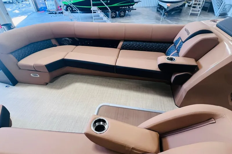 Slide: The Image of Luxurious seating on 2025 Harris 250 Grand Mariner V10 400 boat, featuring plush upholstery and cup holders. - 7