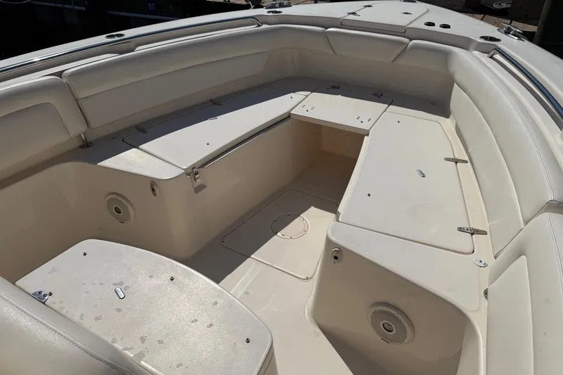 Slide: The Image of 2017 Grady-White Canyon 271 FS boat interior with spacious seating and storage compartments. - 10