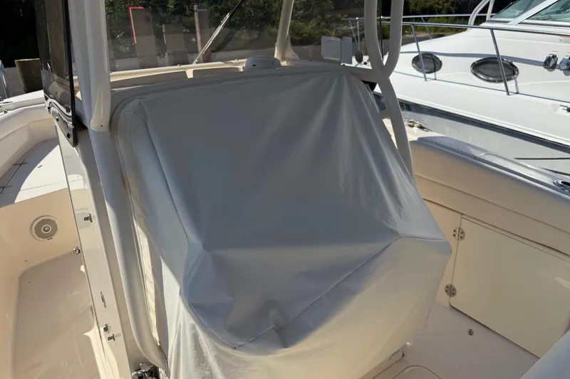 Slide: The Image of 2017 Grady-White Canyon 271 FS boat interior with covered console. - 14