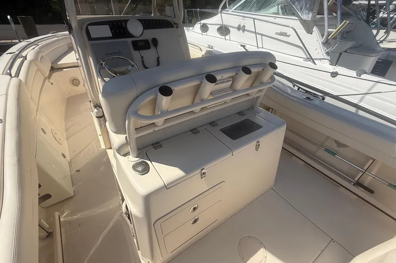 Slide: The Image of 2017 Grady-White Canyon 271 FS boat interior with helm and seating area. - 19