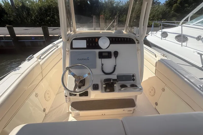 Slide: The Image of 2017 Grady-White Canyon 271 FS boat console with Garmin navigation system. - 20