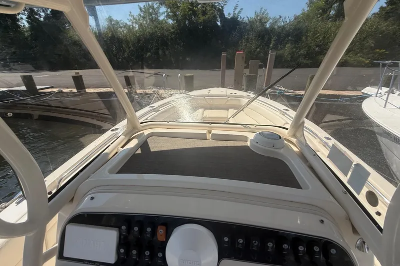 Slide: The Image of 2017 Grady-White Canyon 271 FS boat dashboard view at dock. - 35