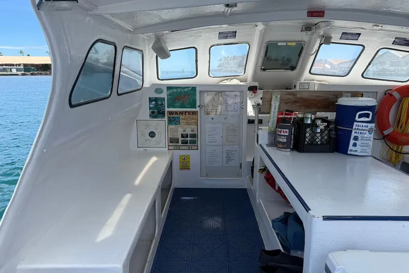 Slide: The Image of Interior of a 2001 Force Power Cat boat with safety equipment and storage. - 11