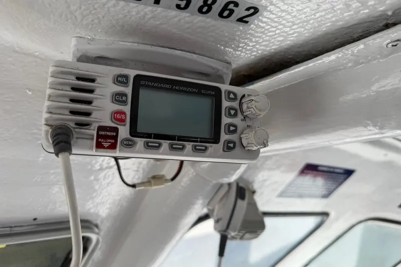 Slide: The Image of Standard Horizon Eclipse radio on 2001 Force Power Cat boat interior. - 14