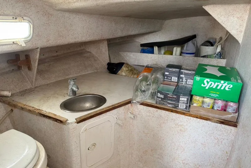 Slide: The Image of 2001 Force Power Cat interior with sink, supplies, and Sprite cans on counter. - 17