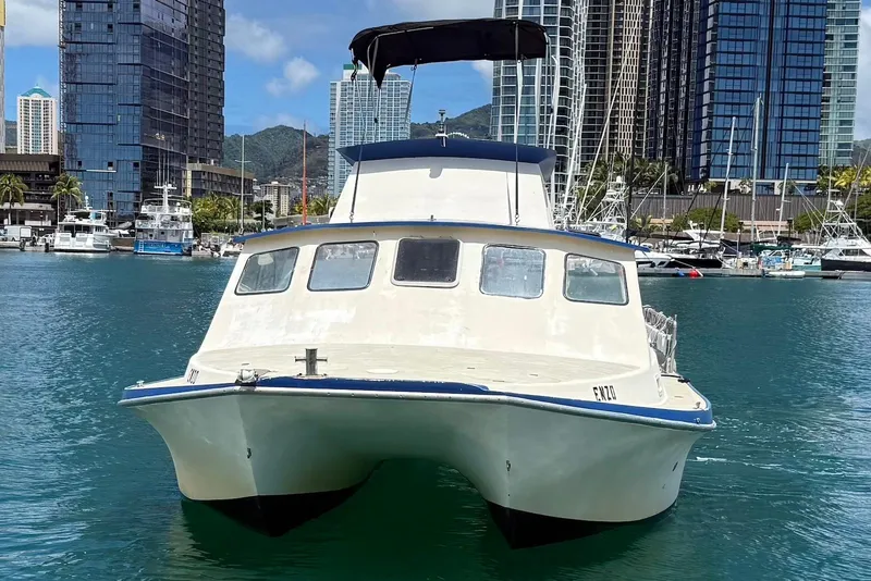 Slide: The Image of 2001 Force Power Cat boat docked in urban marina with skyscrapers in background. - 8