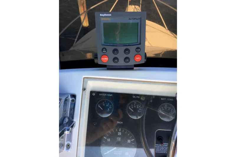 Slide: The Image of Boat dashboard with Raytheon autopilot and gauges, Phoenix 29 SFX, 2000 model. - 16