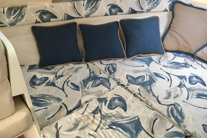 Slide: The Image of Interior of 2000 Phoenix 29 SFX with blue patterned cushions and pillows. - 19