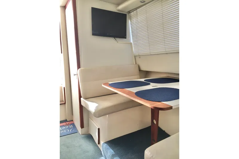 Slide: The Image of Interior of 2000 Phoenix 29 SFX boat with dining area and TV. - 20