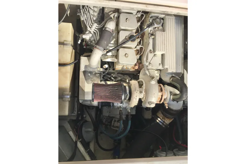 Slide: The Image of Engine compartment of a 2000 Phoenix 29 SFX boat, showcasing mechanical components. - 31