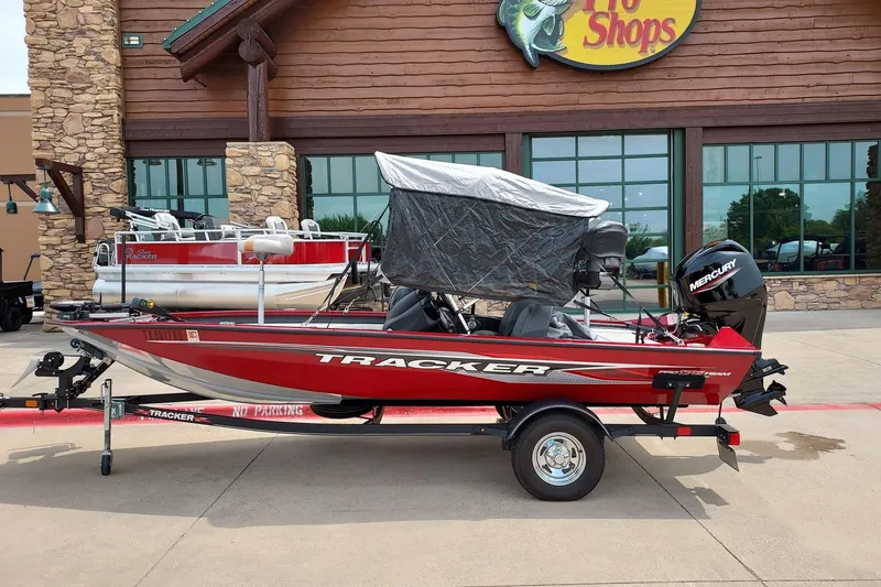 The Image of 2022 Tracker Pro Team 175 TXW boat displayed outside a store. - 1