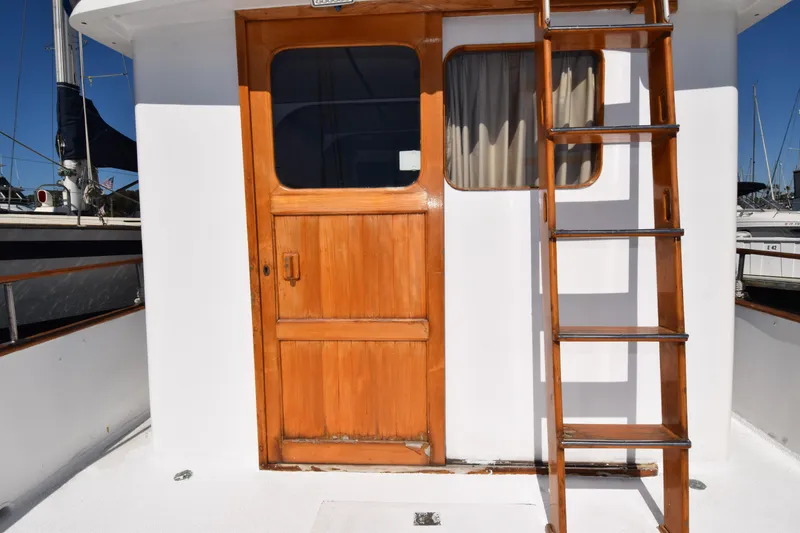 Slide: The Image of Wooden door and ladder on a 1972 CHB 34 boat deck. - 10