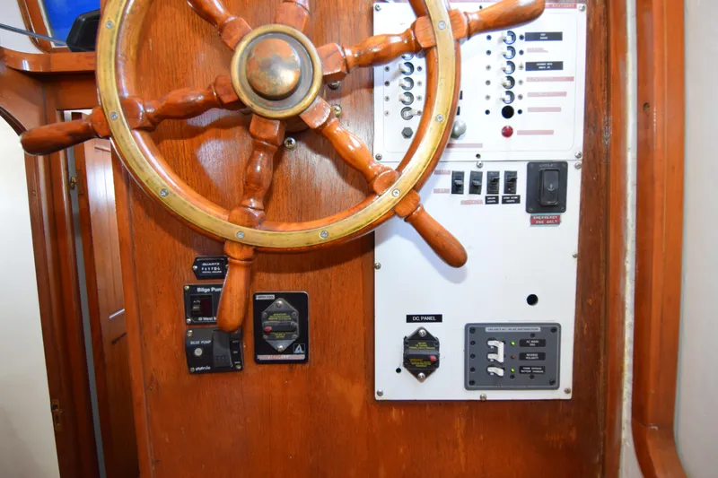 Slide: The Image of Wooden helm and control panel of a 1972 CHB 34 boat. - 16