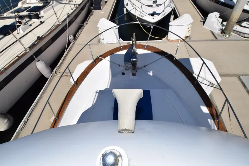 Slide: The Image of 1972 CHB 34 boat docked at marina, view of bow and deck area. - 29