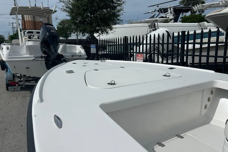 Slide: The Image of 2025 Piranha Magro P180 boat in a marina, featuring sleek design and powerful engine. - 10