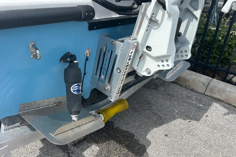 Slide: The Image of 2025 Piranha Magro P180 boat with advanced trim tab system and hydraulic components. - 11