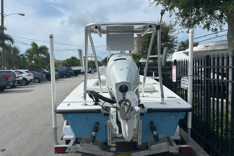 Slide: The Image of 2025 Piranha Magro P180 boat, rear view, parked on a trailer in a lot. - 4