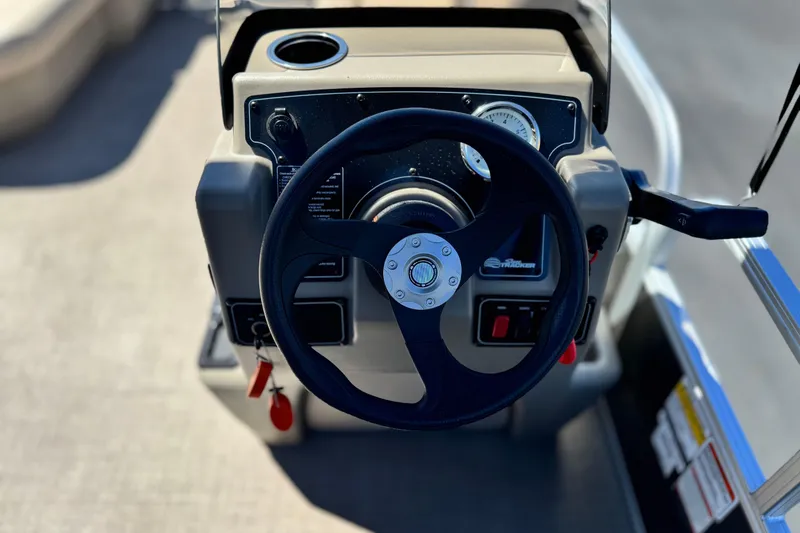 Slide: The Image of Steering console of 2025 Sun Tracker Party Barge 16 DLX pontoon boat. - 19