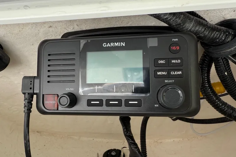 Slide: The Image of Garmin marine radio on 2026 Sea Hunt Ultra 229 boat dashboard. - 18