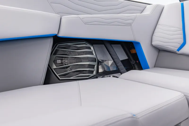 Slide: The Image of 2026 Nautique Super Air Nautique G23 interior with sleek seating and integrated speaker system. - 14