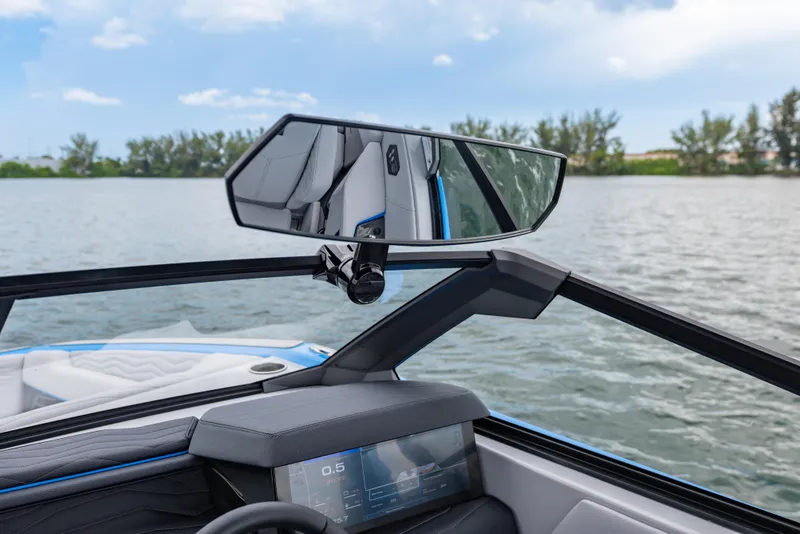 Slide: The Image of 2026 Nautique Super Air Nautique G23 boat interior with rearview mirror and digital display. - 17