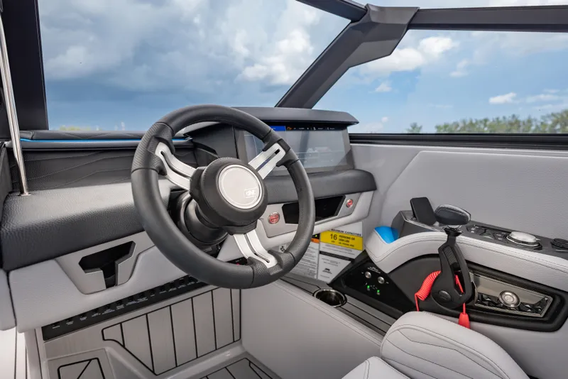 Slide: The Image of 2026 Nautique Super Air Nautique G23 helm with modern steering and controls. - 20