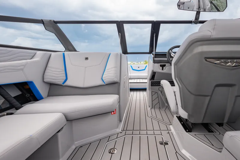 Slide: The Image of 2026 Nautique Super Air Nautique G23 interior with sleek seating and modern design. - 22