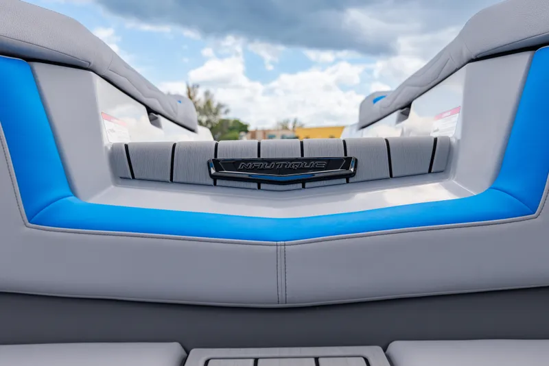Slide: The Image of 2026 Nautique Super Air Nautique G23 boat interior with blue and gray seating. - 3