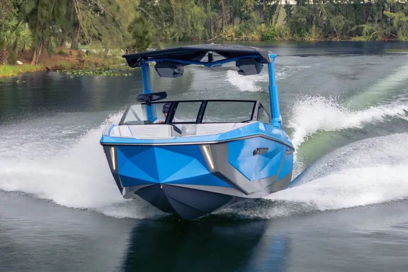 Slide: The Image of 2026 Nautique Super Air Nautique G23 in motion on a scenic waterway. - 36
