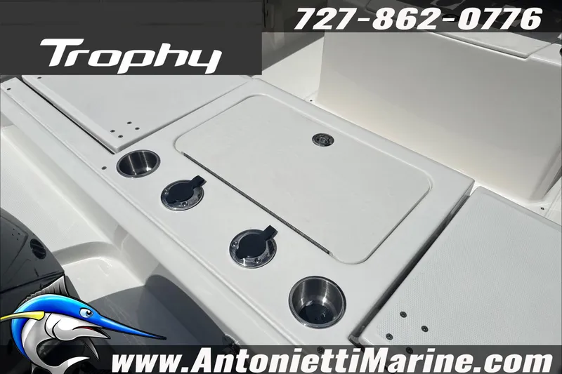 Slide: The Image of 2026 Trophy T22 Center Console boat deck with rod holders and storage. - 14