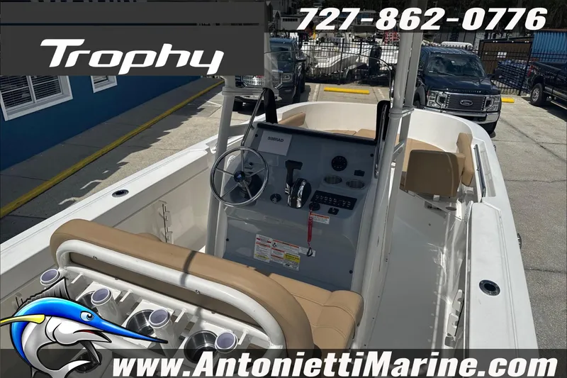 Slide: The Image of 2026 Trophy T22 Center Console boat interior with steering wheel and seating. - 15