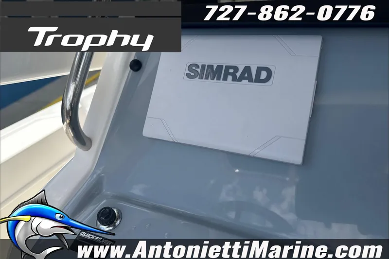 Slide: The Image of 2026 Trophy T22 Center Console boat dashboard with Simrad display, Antonietti Marine branding. - 17