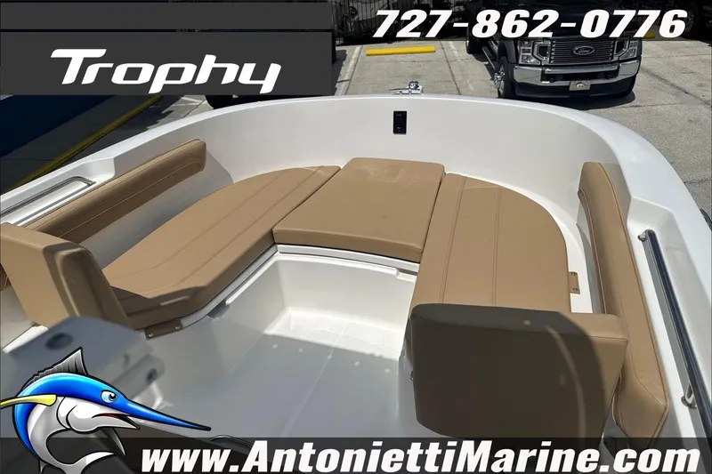 Slide: The Image of 2026 Trophy T22 Center Console boat with tan seating, displayed at Antonietti Marine. - 22