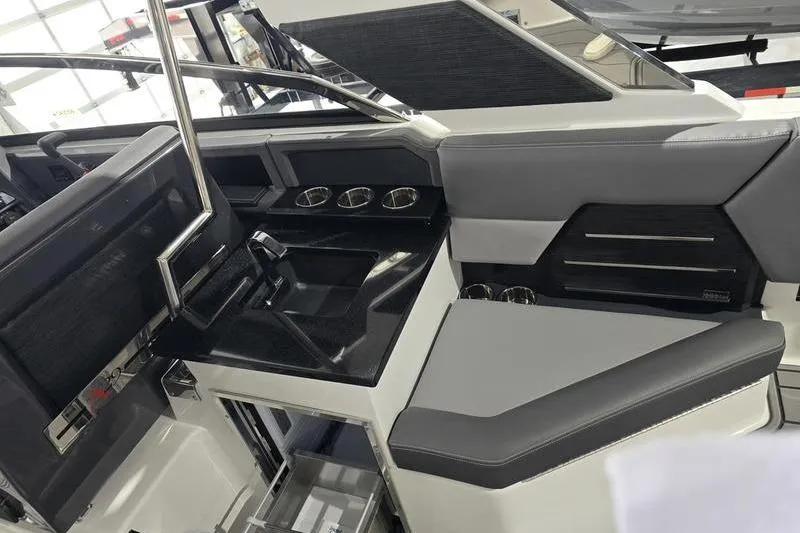 Slide: The Image of 2026 Cobalt A29 boat interior with sleek seating in a modern garage setting. - 11