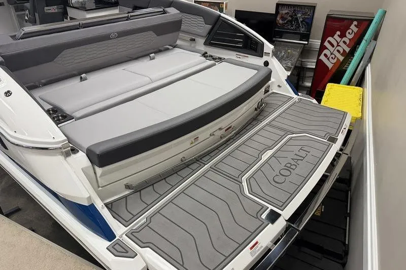 Slide: The Image of 2026 Cobalt A29 boat with spacious seating and swim platform in showroom. - 25