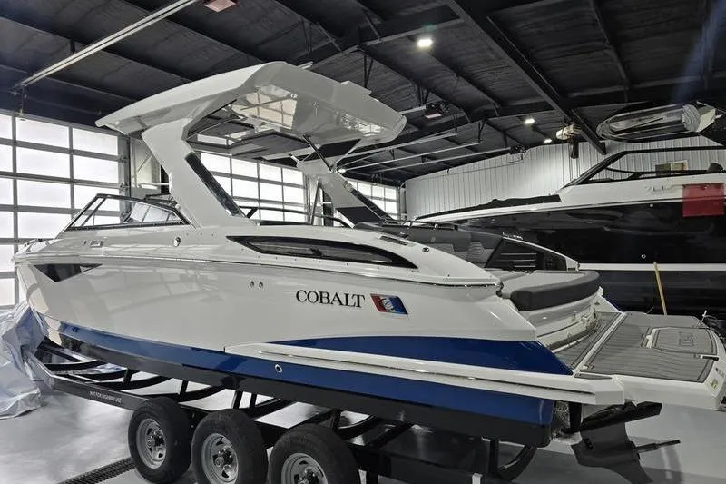 The Image of 2026 Cobalt A29 boat displayed in a showroom with sleek design and modern features. - 3