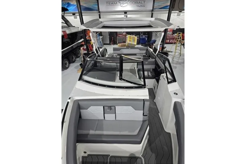 Slide: The Image of 2026 Cobalt A29 boat interior in showroom, featuring sleek design and modern seating. - 6