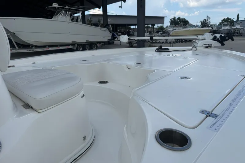 Slide: The Image of 2019 Epic E2 2100 Bay boat interior with seating and fishing rod holders. - 11