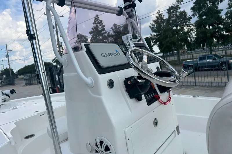 Slide: The Image of 2019 Epic E2 2100 Bay boat console with Garmin navigation system and steering wheel. - 17