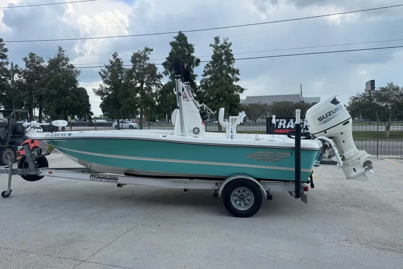 Slide: The Image of 2019 Epic E2 2100 Bay boat on trailer with Suzuki outboard motor. - 6