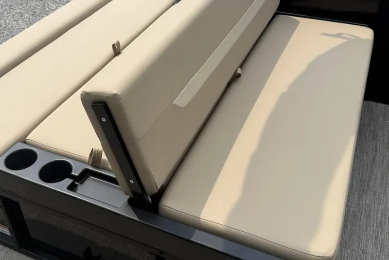 Slide: The Image of 2026 Godfrey Xperience EX2286SFLX boat seating with beige cushions and cup holders. - 10