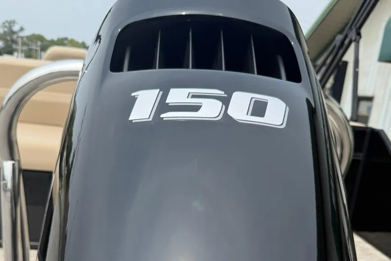 Slide: The Image of Close-up of a 150 HP engine on a 2026 Godfrey Xperience EX2286SFLX boat. - 3