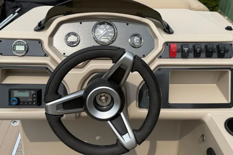 Slide: The Image of Steering console of 2026 Godfrey Xperience EX2286SFLX boat with gauges and controls. - 8
