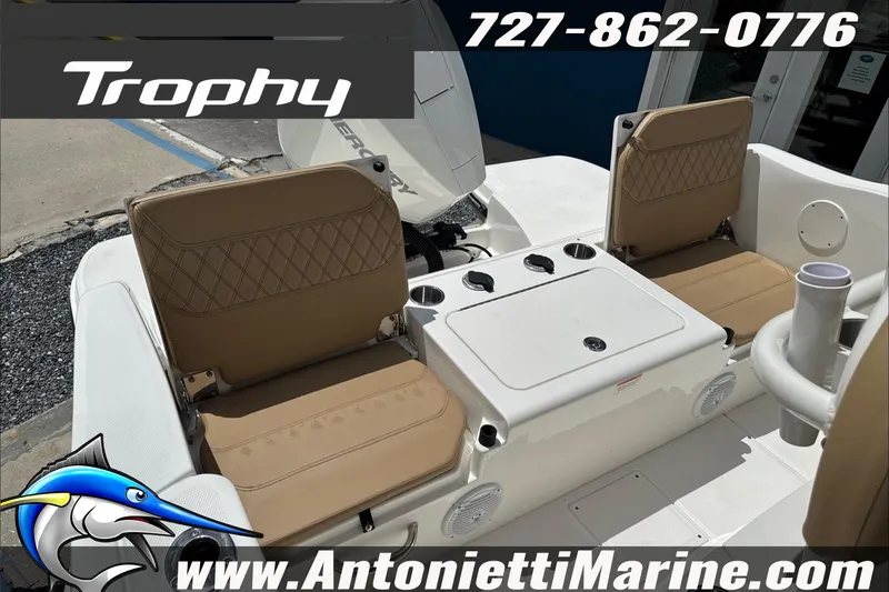 Slide: The Image of 2026 Trophy T22CC Center Console boat interior with tan seating and storage. - 14