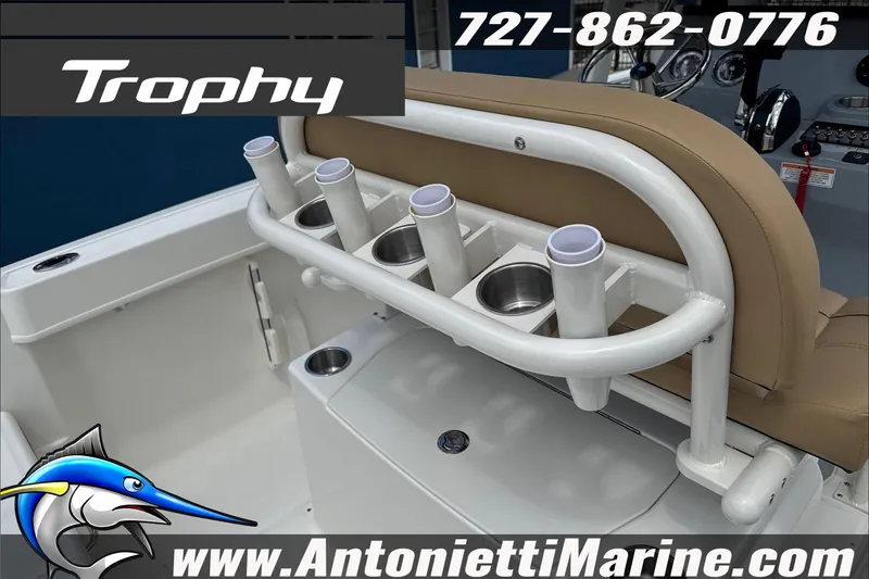 Slide: The Image of 2026 Trophy T22CC Center Console boat interior with rod holders and seating. - 16