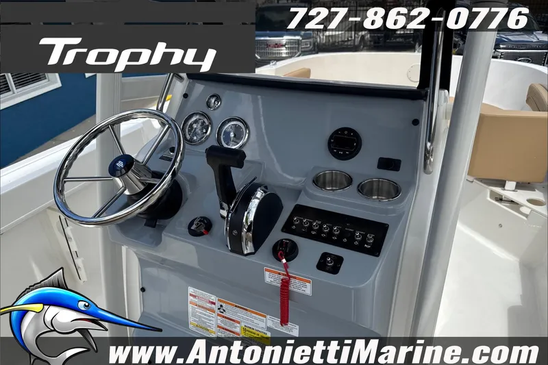 Slide: The Image of 2026 Trophy T22CC Center Console boat dashboard with steering wheel and controls. - 18