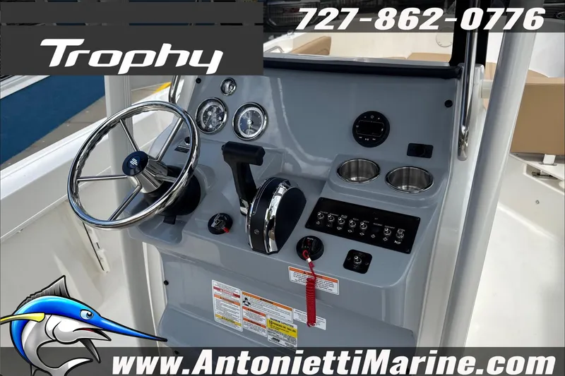 Slide: The Image of 2026 Trophy T22CC Center Console dashboard with steering wheel and controls. - 21